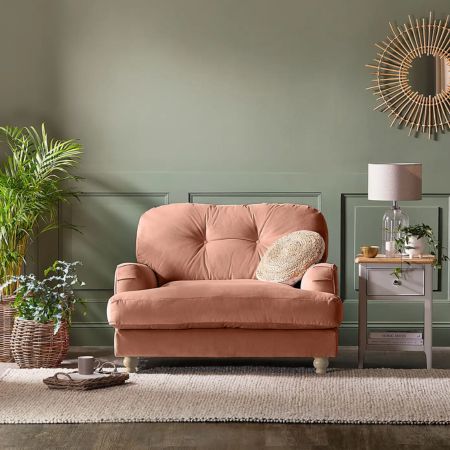 green walls with pink armchair sofa