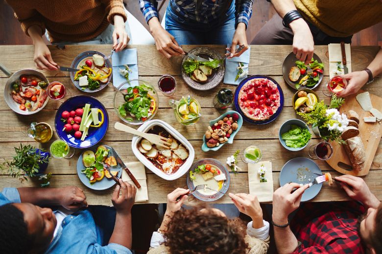 8 people eating on a dining table
